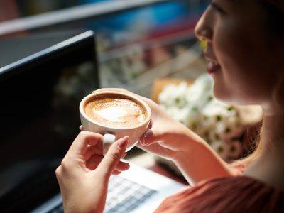 Woman Drinking Coffee in Coffeeshop
